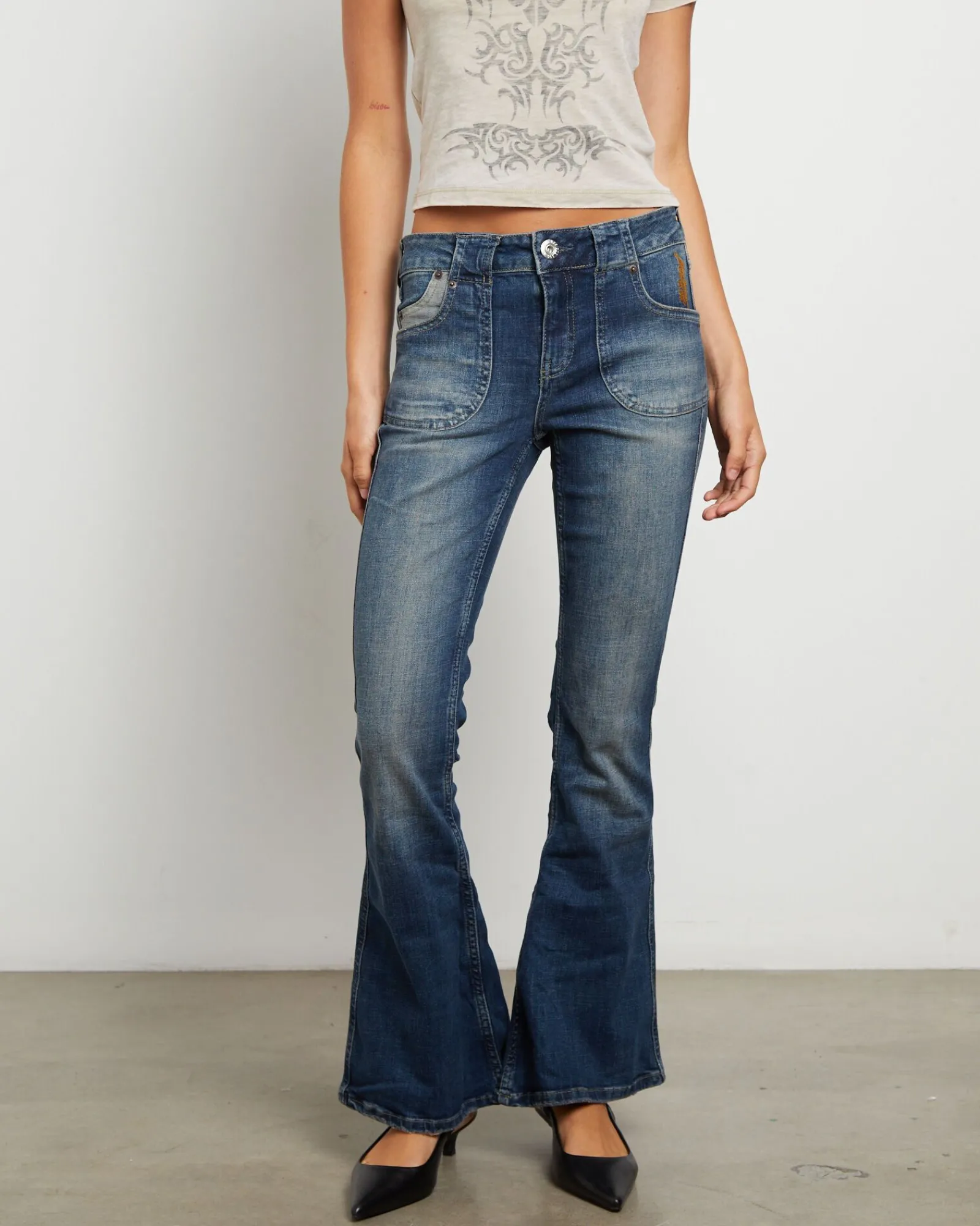 bdg_tiana_low_rise_flare__0.webp Shop BDG URBAN OUTFITTERS Bdg Tiana Low Rise Flare Jeans In Dark Vintage
