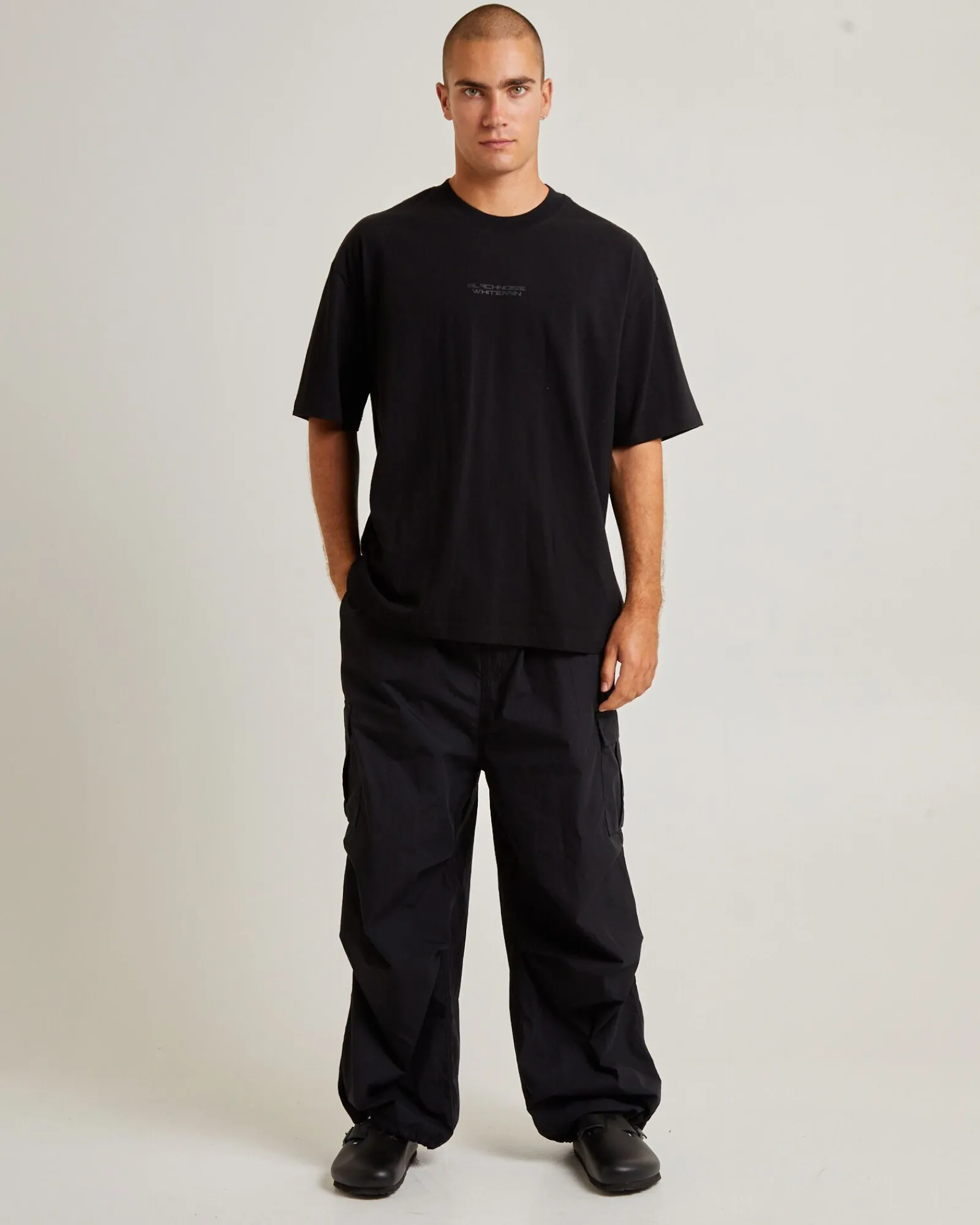 oversized_parachute_cargo_0.webp Best BLACK NOISE WHITE RAIN Oversized Parachute Cargo Pant In Black
